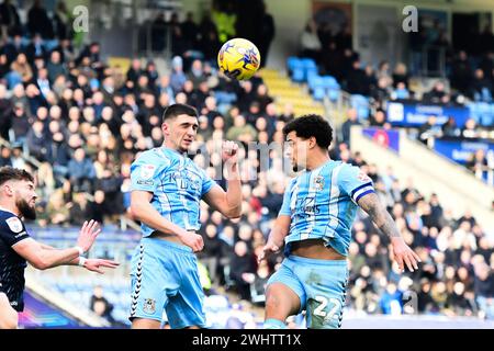 Matt Godden (24 Coventry City) andd Bobby Thomas (4 Coventry City) go for the ball mid air during the Sky Bet Championship match between Coventry City and Millwall at the Coventry Building Society Arena, Coventry on Sunday 11th February 2024. (Photo: Kevin Hodgson | MI News) Credit: MI News & Sport /Alamy Live News Stock Photo