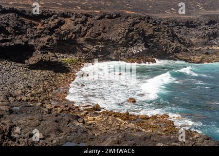 View Over The Rugged Coastline Of Tenesera Lanzarote On A Beautiful view-over-the-rugged-coastline-of-tenesera-lanzarote-on-a-beautiful