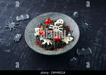 Traditional Halloween octopus spaghetti with Dracula spiders Stock Photo