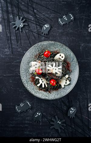 Traditional Halloween octopus spaghetti with Dracula spiders Stock Photo