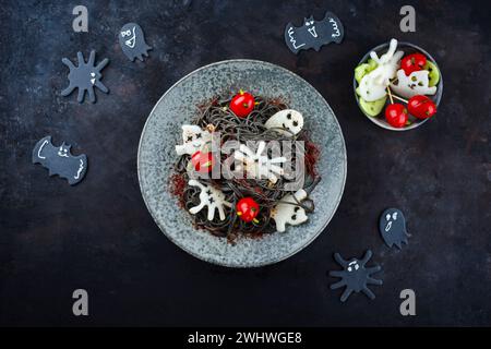 Traditional Halloween octopus spaghetti with Dracula spiders Stock Photo