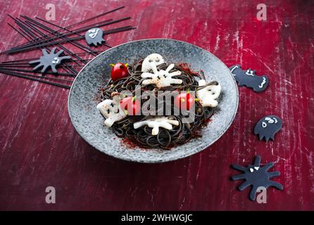 Traditional Halloween octopus spaghetti with Dracula spiders Stock Photo