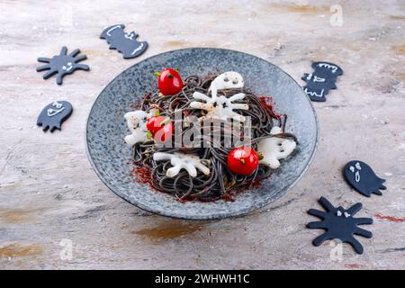 Traditional Halloween octopus spaghetti with Dracula spiders Stock Photo