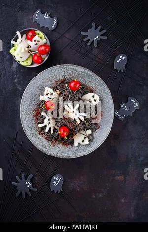 Traditional Halloween octopus spaghetti with Dracula spiders Stock Photo