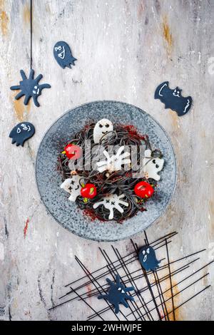 Traditional Halloween octopus spaghetti with Dracula spiders Stock Photo