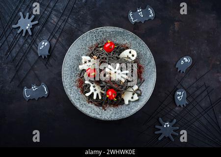 Traditional Halloween octopus spaghetti with Dracula spiders Stock Photo