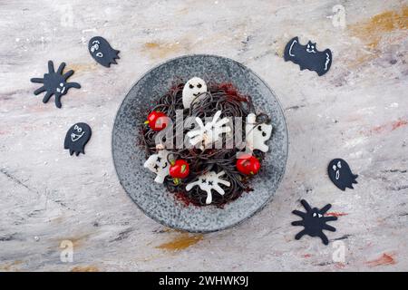 Traditional Halloween octopus spaghetti with Dracula spiders Stock Photo