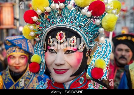 Moscow, Russia. 10th of February, 2024. A Chinese woman dressed as a character from the Beijing Opera performs at a street during the Chinese New Year Festival in Moscow in Kamergersky Lane in Moscow, Russia Stock Photo