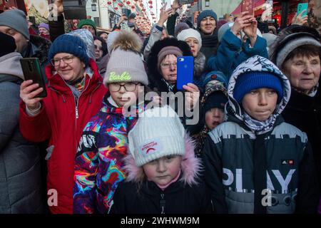 Moscow, Russia. 10th of February, 2024. Russian people watch a performance by Chinese street actors during the Chinese New Year Festival in Kamergersky Lane in Moscow, Russia Stock Photo