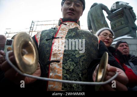 Moscow, Russia. 10th of February, 2024. A Chinese man wearing traditional Chinese costume performs at a street during the Chinese New Year Festival in Kamergersky Lane in Moscow, Russia Stock Photo