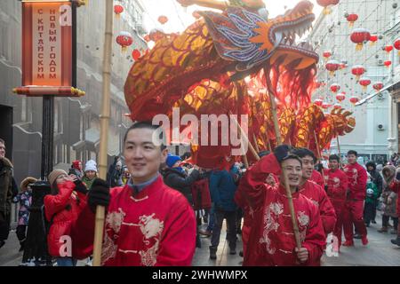 Moscow, Russia. 10th of February, 2024. Artists perform a dragon dance during the Chinese Lunar New Year celebrationat a street during the Chinese New Year Festival in Moscow in Kamergersky Lane, Russia Stock Photo