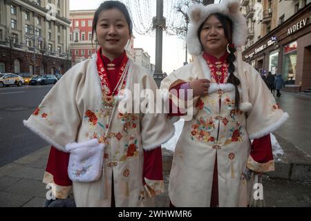 Moscow, Russia. 10th of February, 2024. Asian women walk at Tverskaya street during the Chinese New Year celebration in Moscow, Russia Stock Photo
