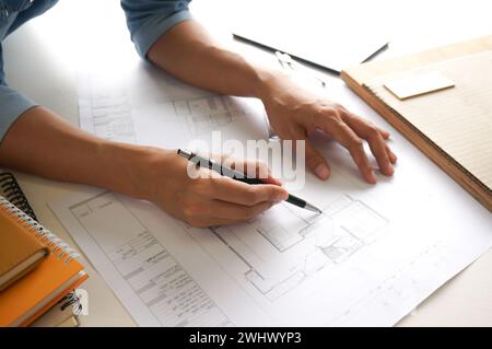 Architecture drawing on architectural project business architecture building construction Colleagues interior designer Corporate Stock Photo