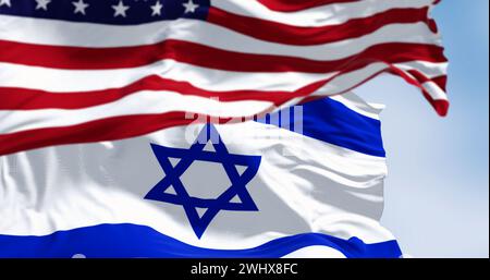 State of Israel national flag waving in the wind with the American flag Stock Photo