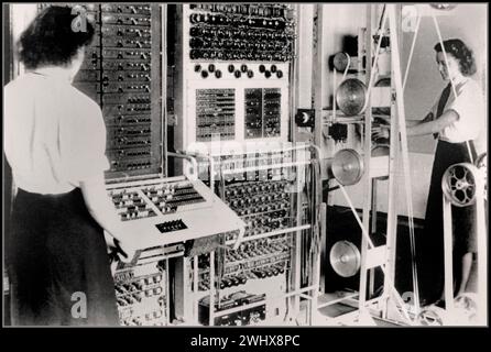 WW2 CODEBREAKING COMPUTER Colossus Mark 2 codebreaking computer being operated by Dorothy Du Boisson (left) and Elsie Booker (right), 1943 Colossus reduced time to work out Lorenz chi-wheel settings and enabled more messages to be deciphered and the whole code-breaking operation accelerated. The information gleaned from the decrypted messages is widely acknowledged to have shortened the war by many months, saving thousands of lives. Colossus Mark 2  used shift registers to quintuple the processing speed, first worked on 1 June 1944, just in time for Normandy landings on D-Day Stock Photo