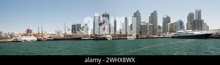 San Diego, California, USA – August 17, 2023. Panoramic view of the downtown San Diego city skyline and Maritime Museum with historic ships Stock Photo