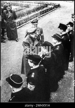 Adolf Hitler last days, Berlin Nazi Germany handing out Iron Cross medals to Hitler Youth HitlerJugend outside his bunker. One of the last images taken before his suicide WW2 1945 World War II Second World War Stock Photo