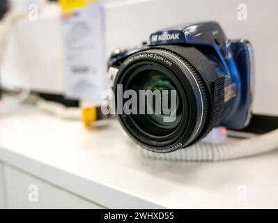 Simple Kodak DSLR camera with an aspheric zoom lens, object closeup, shallow DOF. Optics in photography, photo lens focus and zoom simple abstract con Stock Photo