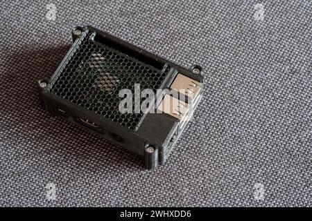 Raspberry Pi small format computer in a 3D printed protective case object closeup, nobody. Single board computers and 3d printed accessories concept, Stock Photo