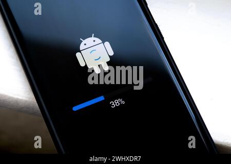 Android phone update installing, in progress, loading screen, smartphone display closeup. Updating mobile device firmware, software upgrade concept, o Stock Photo