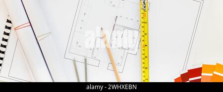 Interior designer table workplace with house plan Stock Photo