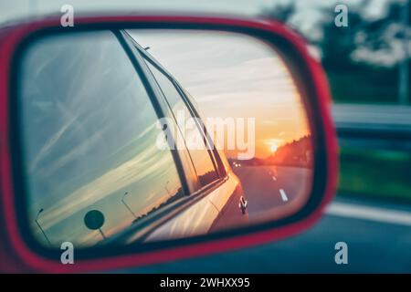 Sunset reflection in the rear view mirror Stock Photo