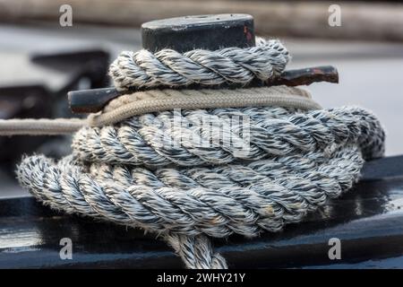 Mooring rope tied around a cleat Stock Photo