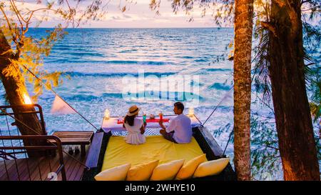 Romantic dinner on the beach in Koh Kood Thailand, couple having dinner on the beach during vacation Stock Photo