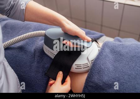 Woman getting treatment on buttocks to burn fat Stock Photo
