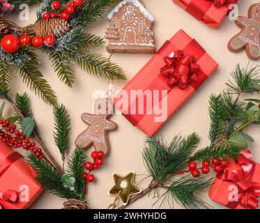 Christmas decor, gift red boxes on beige top view. Place for inscription Stock Photo
