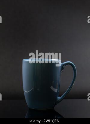 Blue mug isolated on a black background Stock Photo