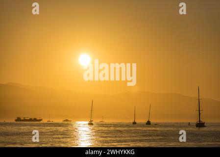 Clear, Orange sunrise, Santa Barbara coast, Stearns Wharf, Coastal view, Morning glow, Sunlight reflection, Coastal beauty Stock Photo