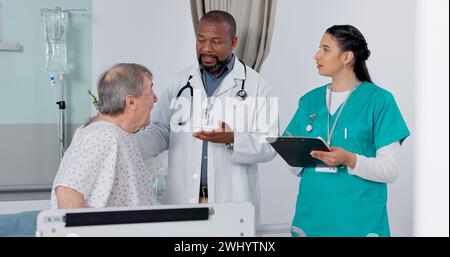 Doctor, nurse and patient in discussion in hospital got medical diagnosis or treatment plan. Clipboard, consultation and team of healthcare workers Stock Photo