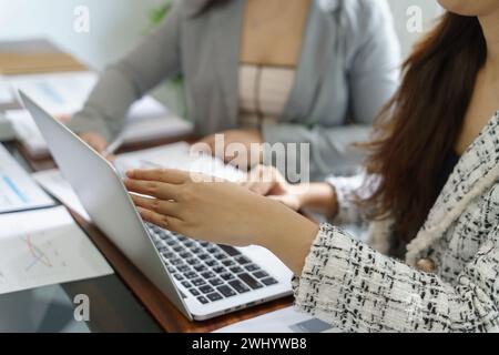 Businesswoman Accountant analyzing investment charts Invoice and Stock Photo