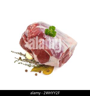 Raw lamb leg with bone, spices Stock Photo