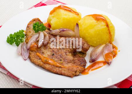 Roast veal liver with shallots, potato dumplings Stock Photo