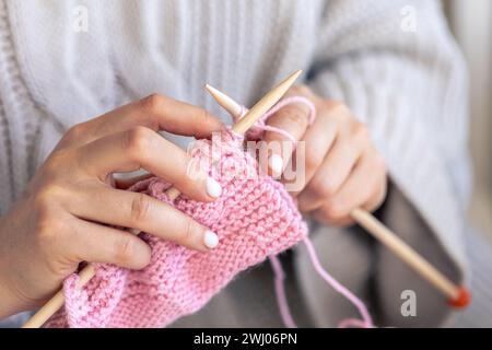 Close-up of hands knitting using circular needles. Stock Photo