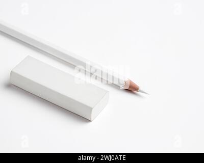 A white pencil and eraser on white background with copy space. Stock Photo