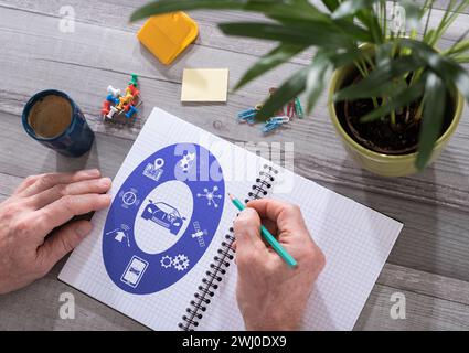 Driverless car concept drawn on a notepad placed on a desk Stock Photo