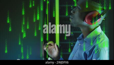 Image of binary coding over african american male it engineer and computer servers Stock Photo