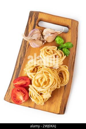 Pasta tagliatelle on a cutting board Stock Photo