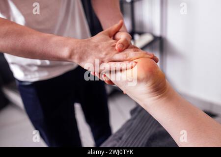 Close up of female foot getting gentle massage Stock Photo
