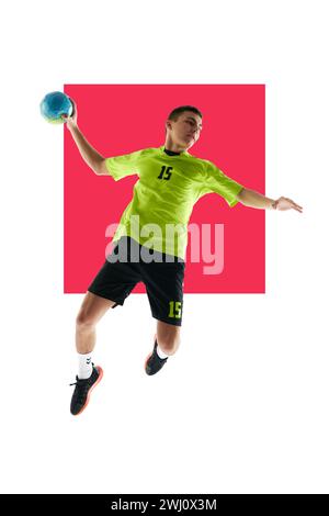 Dynamic image of young man, handball player in motion with ball against white studio background with pink element. Poster for sport event, sport Stock Photo