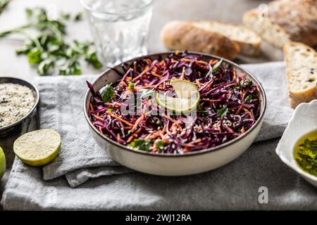 Healthy salad of red cabbage, carrots, coriander and sesame.  Healthy eating, vegan food concept. Stock Photo