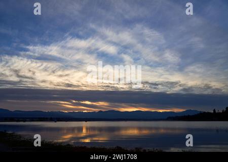 Sunset on the ocean, Dramatic blue and orange sky. Stock Photo