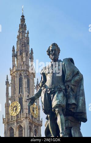 Statue of Pieter Paul Rubens in Groenplaats,  Antwerp, spire  clock tower of Cathedral of Our Lady in the background Stock Photo