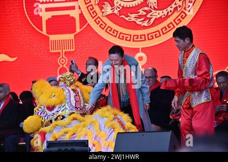 Trafalgar square, London, UK, 11 February 2024: MCs, outro eye-dotting, intro Money God, Ceremony of the 2024 Lunar New Year a spectacular show this year for the 2024 Lunar New Year, with the CPC sponsoring the entire performances that comes from Beijing and Guangzhou. The Lunar New Year is also known as Chinese New Year or Spring Festival. The Chinese celebration in London attracted thousands of people. Experience traditional dragon and flying lion dances and fun-filled stage performances from China, including Beijing opera and acrobatics, martial arts displays, and ancient magic in London, U Stock Photo