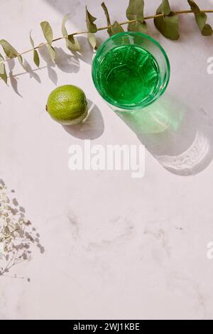 Aesthetic lime healthy tarragon detox sparkling cocktail. Non alcoholic vitaminized healthy beverage. Green Mocktail for St. Patricks Day. Copy space, Stock Photo
