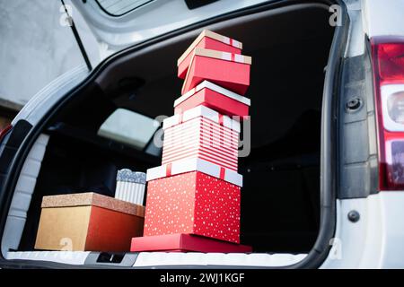 Pile of Christmas gift boxes in car Stock Photo