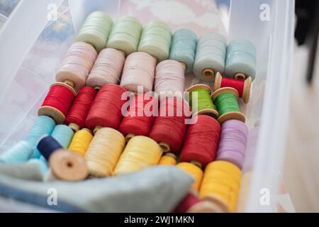 Rolls of thread, spools of thread in different colors for sewing work. Stock Photo